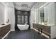 Spa-like bathroom with a freestanding tub and walk-in shower at 7640 Falls Creek Ln, Raleigh, NC 27614