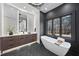 Contemporary bathroom with a double vanity, large mirror, and walk-in shower at 7640 Falls Creek Ln, Raleigh, NC 27614