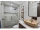 Spa-like bathroom with floating vanity, walk-in shower, and herringbone floor at 7640 Falls Creek Ln, Raleigh, NC 27614