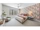 Bedroom with a queen bed and patterned wallcovering at 7640 Falls Creek Ln, Raleigh, NC 27614