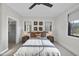 Well-lit bedroom with a full bed and walk-in closet at 7640 Falls Creek Ln, Raleigh, NC 27614