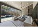 Spacious covered patio with seating area and fireplace at 7640 Falls Creek Ln, Raleigh, NC 27614