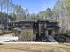 Stunning modern home with stone accents and a landscaped yard at 7640 Falls Creek Ln, Raleigh, NC 27614