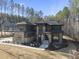 Luxury home showcasing a modern design and wooded setting at 7640 Falls Creek Ln, Raleigh, NC 27614