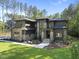 Beautiful new home with manicured lawn, stone accents, and stylish architectural design at 7640 Falls Creek Ln, Raleigh, NC 27614