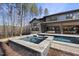 Relaxing hot tub with tiled surround, adjacent to the pool at 7640 Falls Creek Ln, Raleigh, NC 27614
