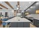 Modern kitchen with a large island, stainless steel appliances, and stylish backsplash at 7640 Falls Creek Ln, Raleigh, NC 27614