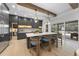 Open kitchen with an expansive island, stainless steel appliances, and access to backyard at 7640 Falls Creek Ln, Raleigh, NC 27614