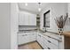 Laundry room with white cabinets and granite countertops at 7640 Falls Creek Ln, Raleigh, NC 27614
