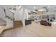 Open-concept living area with hardwood floors and a fireplace at 7640 Falls Creek Ln, Raleigh, NC 27614