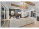 Open living area with a comfortable sectional sofa and a modern fireplace at 7640 Falls Creek Ln, Raleigh, NC 27614