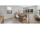 Home office with built-in desk and adjacent seating area at 7640 Falls Creek Ln, Raleigh, NC 27614