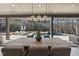 Large outdoor dining table with seating for six, overlooking the pool at 7640 Falls Creek Ln, Raleigh, NC 27614