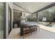 Outdoor kitchen with built-in grill, stone countertops, and seating area at 7640 Falls Creek Ln, Raleigh, NC 27614