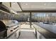 High-end outdoor kitchen features stainless steel appliances and stone counters at 7640 Falls Creek Ln, Raleigh, NC 27614