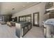Outdoor kitchen with a grill, bar seating, and fireplace at 7640 Falls Creek Ln, Raleigh, NC 27614