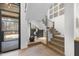 Modern staircase with metal railing and wood steps at 7640 Falls Creek Ln, Raleigh, NC 27614