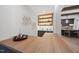 Modern wet bar with wood countertop, wine cooler, and stylish shelving at 7640 Falls Creek Ln, Raleigh, NC 27614