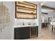 Contemporary wet bar featuring a herringbone backsplash and built-in wine cooler at 7640 Falls Creek Ln, Raleigh, NC 27614