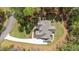 Overhead view of home nestled on manicured lawn and long driveway at 330 Hidden Lake Dr, Youngsville, NC 27596
