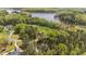 Beautiful aerial view of home, large yard, and wooded area near the lake at 330 Hidden Lake Dr, Youngsville, NC 27596