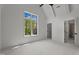 Bright bedroom featuring carpet, a ceiling fan, and a window with a view of the trees at 330 Hidden Lake Dr, Youngsville, NC 27596