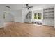 Spacious bonus room with hardwood floors, custom built-ins, window seat and ceiling fan at 330 Hidden Lake Dr, Youngsville, NC 27596