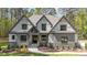 Charming gray home featuring a mixed material facade and professionally landscaped front yard at 330 Hidden Lake Dr, Youngsville, NC 27596
