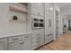Kitchen area with stainless steel microwave and refrigerator and matching hardware at 330 Hidden Lake Dr, Youngsville, NC 27596