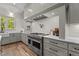 Gourmet kitchen with stainless steel range, custom cabinets, and contrasting countertops at 330 Hidden Lake Dr, Youngsville, NC 27596