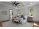 Beautiful main bedroom featuring tray ceiling, hardwood floors, and ensuite bathroom at 330 Hidden Lake Dr, Youngsville, NC 27596