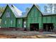 New home under construction showing Zip System sheathing, brick base and a two car garage at 3331 Colby Chase Dr # 8, Apex, NC 27539