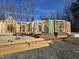 Exterior view of a new construction home's framing progress on a sunny day at 3340 Colby Chase Dr # 2, Apex, NC 27539