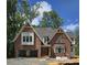 New brick home with a two-car garage, multiple windows, and a well-manicured lawn at 3340 Colby Chase Dr # 2, Apex, NC 27539