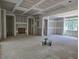 Unfinished living room with fireplace and large windows, awaiting customization and finishing touches at 3340 Colby Chase Dr # 2, Apex, NC 27539