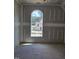 Unfinished room with window view of the community; shows bare walls and floors at 3340 Colby Chase Dr # 2, Apex, NC 27539