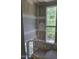Spacious stairwell with large windows offering bright, natural light and unfinished drywall at 3340 Colby Chase Dr # 2, Apex, NC 27539