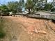 An empty backyard with a fence and some construction materials scattered around at 627 Georgetown Rd, Raleigh, NC 27608