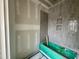 Bathroom with gray tiling surrounding the tub and built in niche for extra storage at 627 Georgetown Rd, Raleigh, NC 27608
