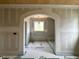 Arched doorway leads to a bathroom featuring shiplap ceiling and tiled shower at 627 Georgetown Rd, Raleigh, NC 27608
