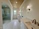 Bathroom boasts dual vanities, arched ceiling with wood paneling, and a glass enclosed shower at 627 Georgetown Rd, Raleigh, NC 27608