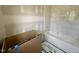Bathroom features a white tiled tub with tiled walls and a built in niche for storage at 627 Georgetown Rd, Raleigh, NC 27608