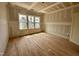 Spacious bedroom features wood floors and plenty of natural light at 627 Georgetown Rd, Raleigh, NC 27608