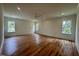 Spacious bedroom with natural light, hardwood floors, recessed lighting and a ceiling fan at 627 Georgetown Rd, Raleigh, NC 27608