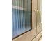 Close up of a cabinet with fluted glass and antique gold hardware at 627 Georgetown Rd, Raleigh, NC 27608