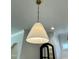 Elegant, cone-shaped chandelier hangs from the ceiling at 627 Georgetown Rd, Raleigh, NC 27608