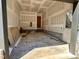 Spacious garage awaiting completion with door leading to outside at 627 Georgetown Rd, Raleigh, NC 27608