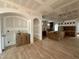 Expansive kitchen and living space with hardwood floors and cabinets awaiting installation at 627 Georgetown Rd, Raleigh, NC 27608