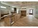 An open-concept living room with hardwood floors, recessed lighting, and an arched entryway at 627 Georgetown Rd, Raleigh, NC 27608