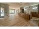 Open living room with hardwood floors and large windows, prepped for finishing touches and personal design at 627 Georgetown Rd, Raleigh, NC 27608